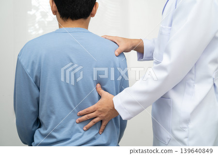 Physical therapy, Asian therapist doctor treat perform pain young man in hospital. Physical therapy, Asian therapist doctor treat perform pain young man in hospital. 139640849