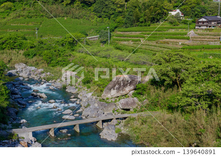 A long, low-water bridge spanning the Doi River, a tributary of the Niyodo River, in the pristine river scenery of Kochi Prefecture. A long, low-water bridge spanning the Doi River, a tributary of the Niyodo River, in the pristine river scenery of Kochi Prefecture. 139640891