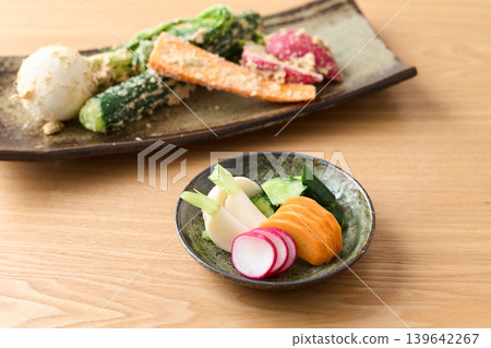 Pickled cucumbers, turnips, carrots, and radishes in rice bran Pickled cucumbers, turnips, carrots, and radishes in rice bran 139642267