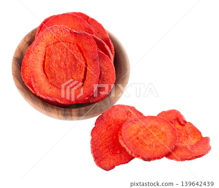 Crispy roasted carrot chips with sea salt, isolated on white background. Healthy and crunchy natural vegetable snack. Clipping path. 139642439