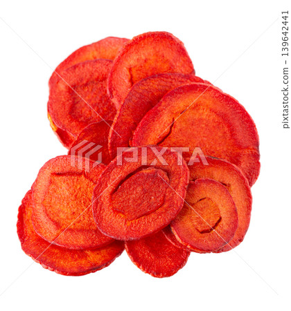 Crispy roasted carrot chips with sea salt, isolated on white background. Healthy and crunchy natural vegetable snack. Clipping path. 139642441