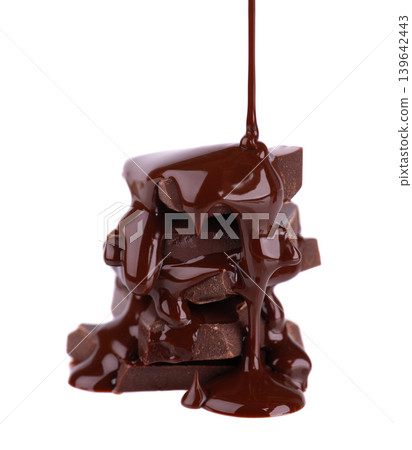 Liquid chocolate syrup pouring over a stack of chocolate pieces isolated on a white background. Clipping path. Liquid chocolate syrup pouring over a stack of chocolate pieces isolated on a white background. Clipping path. 139642443