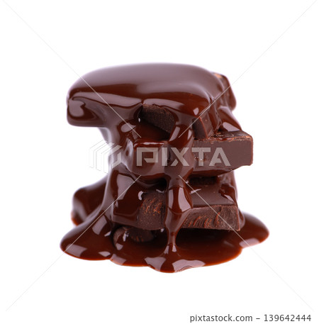Liquid chocolate syrup pouring over a stack of chocolate pieces isolated on a white background. Clipping path. Liquid chocolate syrup pouring over a stack of chocolate pieces isolated on a white background. Clipping path. 139642444