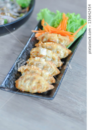 Chinese dumpling, dumpling or wonton or fried wonton or gyoza or Japanese fried dumpling 139642454