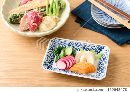 Pickled cucumbers, turnips, carrots, and radishes in rice bran Pickled cucumbers, turnips, carrots, and radishes in rice bran 139642478