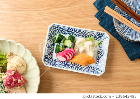 Pickled cucumbers, turnips, carrots, and radishes in rice bran 139642485