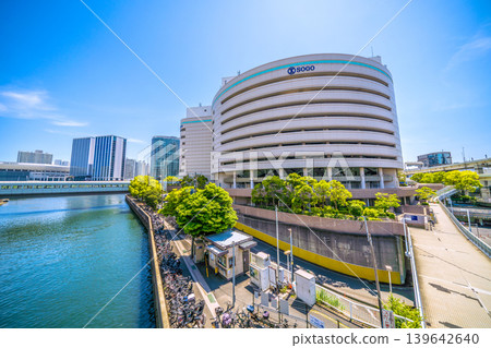 A view of Yokohama, Japan, including the Yokohama Station East Exit Second Bicycle Parking Lot and the Sogo Yokohama department store. Shin-Takashima is in the background to the left. 139642640