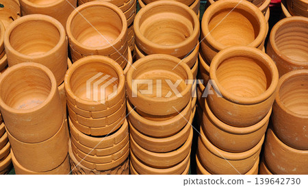 Stacks of new unglazed terracotta clay pots Stacks of new unglazed terracotta clay pots 139642730