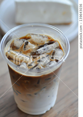 iced coffee , iced latte coffee or iced cappuccino coffee and coconut cake iced coffee , iced latte coffee or iced cappuccino coffee and coconut cake 139643036