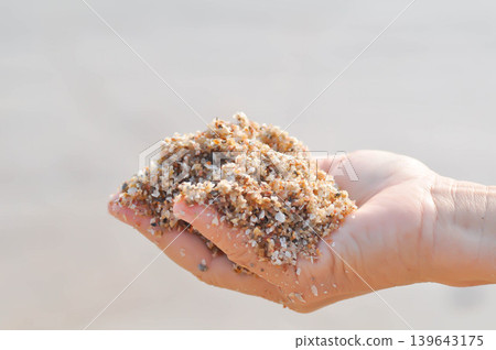 sand, holding sand or beach sand or sea sand or play sand sand, holding sand or beach sand or sea sand or play sand 139643175