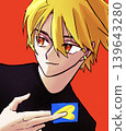 A blonde man holding a card 139643280