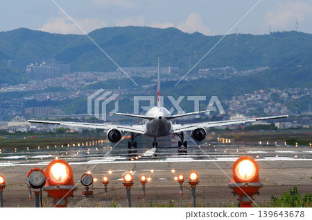 Jet aircraft on the runway at Itami Airport Jet aircraft on the runway at Itami Airport 139643678