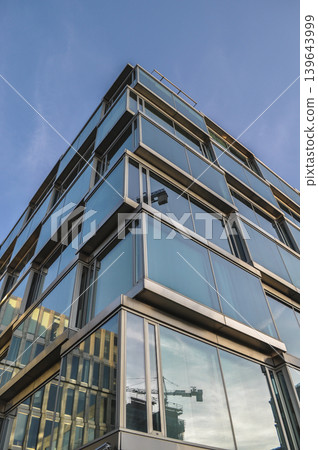glass office building blue architecture office district glass office building blue architecture office district 139643999