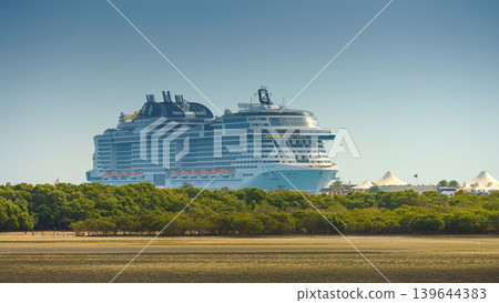 Sir Bani Yas island, United Arab Emirates - jan 18 2024, panoramic view of the MSC Virtuosa multi-deck cruise ship, in the foreground island's natural landscape, Sir Bani Yas, United Arab Emirates  139644383