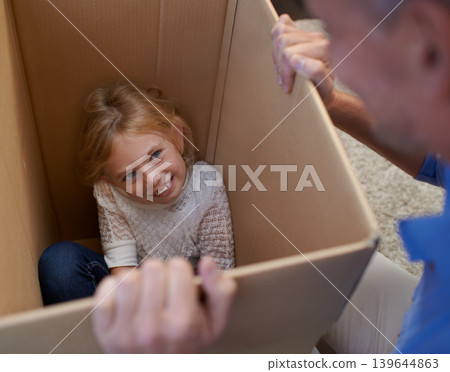 Moving, playing and girl in box with dad, fun in new home and happy package in apartment. Smile, father and playful child in cardboard with games, hiding and property investment for future family. Moving, playing and girl in box with dad, fun in new home and happy package in apartment. Smile, father and playful child in cardboard with games, hiding and property investment for future family. 139644863