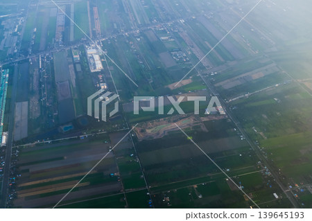Looking from airplane of the Taipei city view, Taiwan. Ariel view of Taipei cityscape. Stunning nature and cityscape. Travel concept. Looking from airplane of the Taipei city view, Taiwan. Ariel view of Taipei cityscape. Stunning nature and cityscape. Travel concept. 139645193