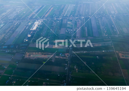 Looking from airplane of the Taipei city view, Taiwan. Ariel view of Taipei cityscape. Stunning nature and cityscape. Travel concept. Looking from airplane of the Taipei city view, Taiwan. Ariel view of Taipei cityscape. Stunning nature and cityscape. Travel concept. 139645194