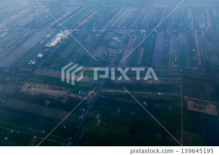 Looking from airplane of the Taipei city view, Taiwan. Ariel view of Taipei cityscape. Stunning nature and cityscape. Travel concept. Looking from airplane of the Taipei city view, Taiwan. Ariel view of Taipei cityscape. Stunning nature and cityscape. Travel concept. 139645195
