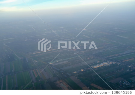 Looking from airplane of the Taipei city view, Taiwan. Ariel view of Taipei cityscape. Stunning nature and cityscape. Travel concept. Looking from airplane of the Taipei city view, Taiwan. Ariel view of Taipei cityscape. Stunning nature and cityscape. Travel concept. 139645196