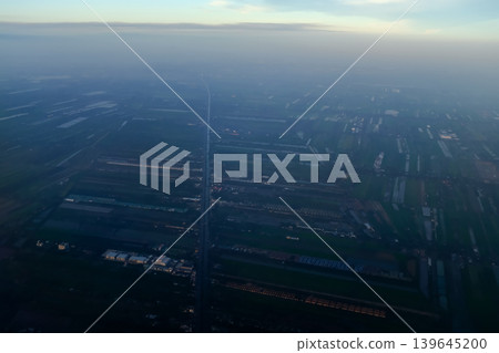 Looking from airplane of the Taipei city view, Taiwan. Ariel view of Taipei cityscape. Stunning nature and cityscape. Travel concept. Looking from airplane of the Taipei city view, Taiwan. Ariel view of Taipei cityscape. Stunning nature and cityscape. Travel concept. 139645200