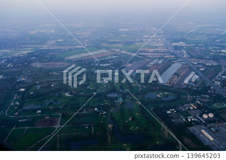 Looking from airplane of the Taipei city view, Taiwan. Ariel view of Taipei cityscape. Stunning nature and cityscape. Travel concept. Looking from airplane of the Taipei city view, Taiwan. Ariel view of Taipei cityscape. Stunning nature and cityscape. Travel concept. 139645203