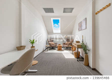 Modern office lounge area with skylight and two armchairs Modern office lounge area with skylight and two armchairs 139645466