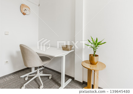 Minimalist modern office workspace with height adjustable desk Minimalist modern office workspace with height adjustable desk 139645480