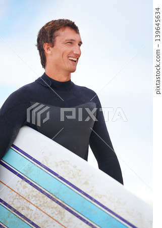 Surfer, happy man on beach and surfboard, vacation and adventure for fitness and travel outdoor. Ocean, waves for surfing and seaside holiday in Hawaii, nature and tourism with extreme sports Surfer, happy man on beach and surfboard, vacation and adventure for fitness and travel outdoor. Ocean, waves for surfing and seaside holiday in Hawaii, nature and tourism with extreme sports 139645634