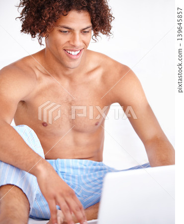 Man, laptop and relaxing in bed on technology, blog and subscription for movie at home. Male person, website and internet connection for online entertainment, search and scroll on streaming service Man, laptop and relaxing in bed on technology, blog and subscription for movie at home. Male person, website and internet connection for online entertainment, search and scroll on streaming service 139645857