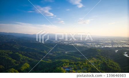 View of the area around Toyama Bay from the hills in the evening. View of the area around Toyama Bay from the hills in the evening. 139646983