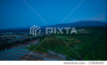View of the area around Toyama Bay from the hills in the evening. View of the area around Toyama Bay from the hills in the evening. 139646987