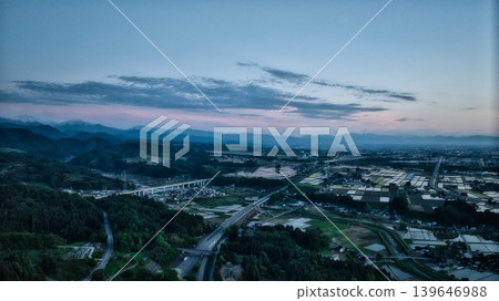 View of the area around Toyama Bay from the hills in the evening. View of the area around Toyama Bay from the hills in the evening. 139646988