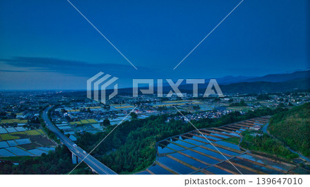 View of the area around Toyama Bay from the hills in the evening. View of the area around Toyama Bay from the hills in the evening. 139647010
