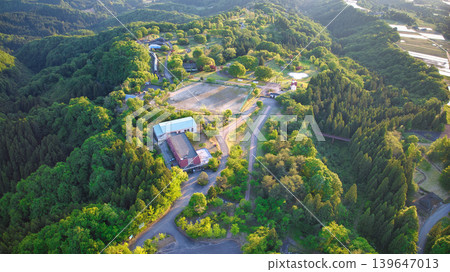 View of the area around Toyama Bay from the hills in the evening. View of the area around Toyama Bay from the hills in the evening. 139647013