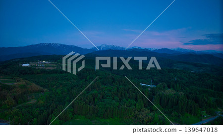 View of the area around Toyama Bay from the hills in the evening. View of the area around Toyama Bay from the hills in the evening. 139647018