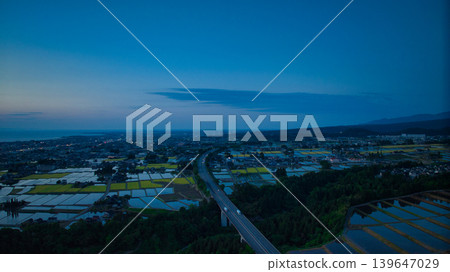 View of the area around Toyama Bay from the hills in the evening. View of the area around Toyama Bay from the hills in the evening. 139647029