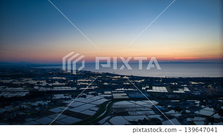 View of the area around Toyama Bay from the hills in the evening. View of the area around Toyama Bay from the hills in the evening. 139647041