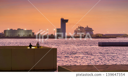 Abu Dhabi, United Arab Emirates - Jan 17 2024, Panoramic view of Abu Dhabi port with moored cruise ship MSC Viruosa, from the Louvre Abu Dhabi, at sunset, Abu Dhabi, United Arab Emirates Abu Dhabi, United Arab Emirates - Jan 17 2024, Panoramic view of Abu Dhabi port with moored cruise ship MSC Viruosa, from the Louvre Abu Dhabi, at sunset, Abu Dhabi, United Arab Emirates 139647354