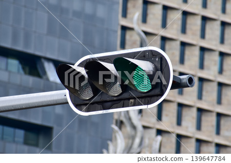 Traffic lights in Hong Kong with blurred buildings background. Hong Kong Cityscape. Traffic lights in Hong Kong with blurred buildings background. Hong Kong Cityscape. 139647784