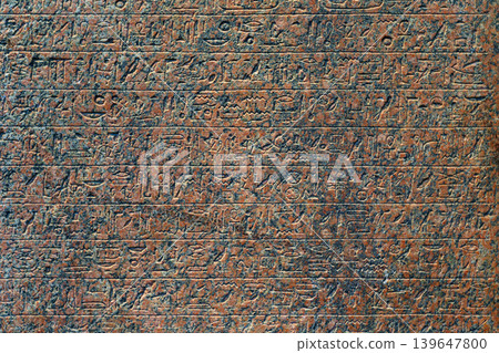 Abu Dhabi, United Arab Emirates - Jan 17 2024, close up view of ancient Egyptian hieroglyphs carved on a granite slab on exhibition of Louvre Abu Dhabi museum, Abu Dhabi, UAE Abu Dhabi, United Arab Emirates - Jan 17 2024, close up view of ancient Egyptian hieroglyphs carved on a granite slab on exhibition of Louvre Abu Dhabi museum, Abu Dhabi, UAE 139647800