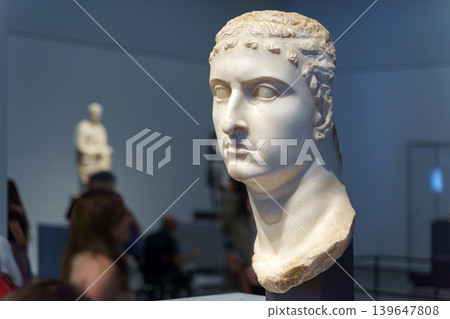 Abu Dhabi, United Arab Emirates - Jan 17 2024, Close-up view of the Queen's Head, an ancient sculpture on the exhibition at the Louvre Abu Dhabi Museum, Abu Dhabi, United Arab Emirates Abu Dhabi, United Arab Emirates - Jan 17 2024, Close-up view of the Queen's Head, an ancient sculpture on the exhibition at the Louvre Abu Dhabi Museum, Abu Dhabi, United Arab Emirates 139647808