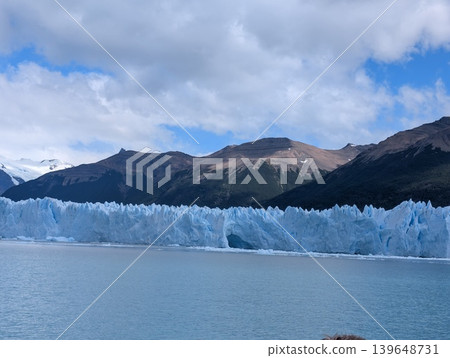 Los Glaciares National Park in Argentina. Cloudy skies. Perito Moreno Glacier and mountains. Los Glaciares National Park in Argentina. Cloudy skies. Perito Moreno Glacier and mountains. 139648731