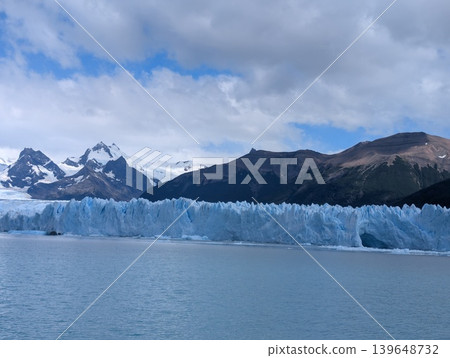 Los Glaciares National Park in Argentina. Cloudy skies. Perito Moreno Glacier and the snow-capped Andes Mountains. 139648732