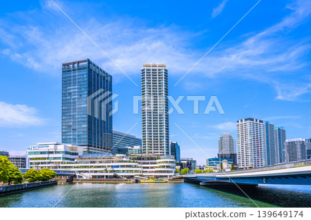 Yokohama cityscape, Japan, May 13th. View from the north-east exit side of Yokohama Station, overlooking Yokohama Bay Quarter and other landmarks. Yokohama cityscape, Japan, May 13th. View from the north-east exit side of Yokohama Station, overlooking Yokohama Bay Quarter and other landmarks. 139649174