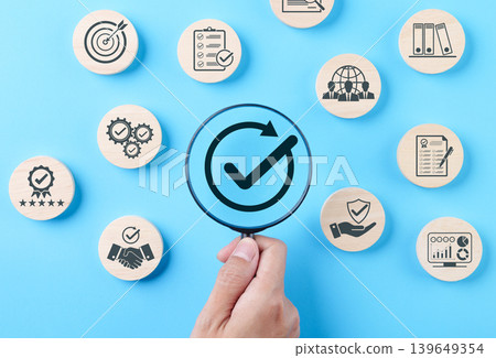 Quality assurance verification and business compliance audit concept, magnifying glass over check mark with icons for checklist review, document control, protection, certification, certificate, Quality assurance verification and business compliance audit concept, magnifying glass over check mark with icons for checklist review, document control, protection, certification, certificate, 139649354