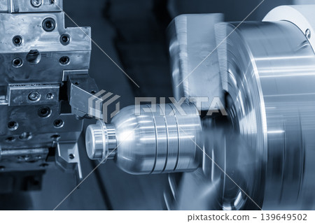 High-precision surface finishing process of a metal mandrel part using a CNC lathe machine in a light blue scene. 139649502