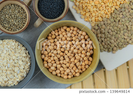 Chickpeas in bowl. Various vegetarian organic products. Protein products for vegetarians. Top view. Chickpeas in bowl. Various vegetarian organic products. Protein products for vegetarians. Top view. 139649814