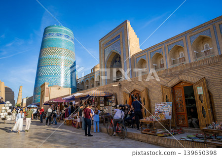 Uzbekistan, Khiva: The bustling streets near Kalta Minor, a UNESCO World Heritage site. Uzbekistan, Khiva: The bustling streets near Kalta Minor, a UNESCO World Heritage site. 139650398