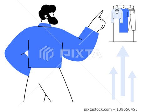Fashion trends, shopping habits, business growth, consumer behavior, retail analytics, style choices. A man pointing at hanging clothes with upward arrows. Fashion trends and shopping habits concepts Fashion trends, shopping habits, business growth, consumer behavior, retail analytics, style choices. A man pointing at hanging clothes with upward arrows. Fashion trends and shopping habits concepts 139650453