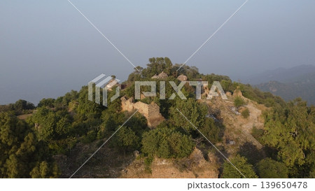 Tilla jogian abandoned hindu temple complex on highest salt range peak surrounded by forest after centuries Tilla jogian abandoned hindu temple complex on highest salt range peak surrounded by forest after centuries 139650478